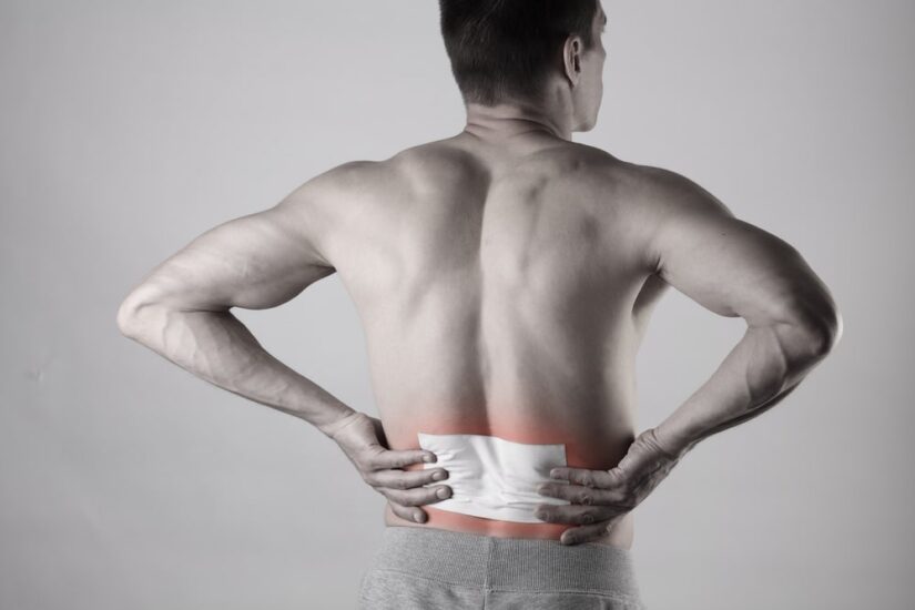 Black And White Photo Of A Man And Red Colour Over His Lower Back